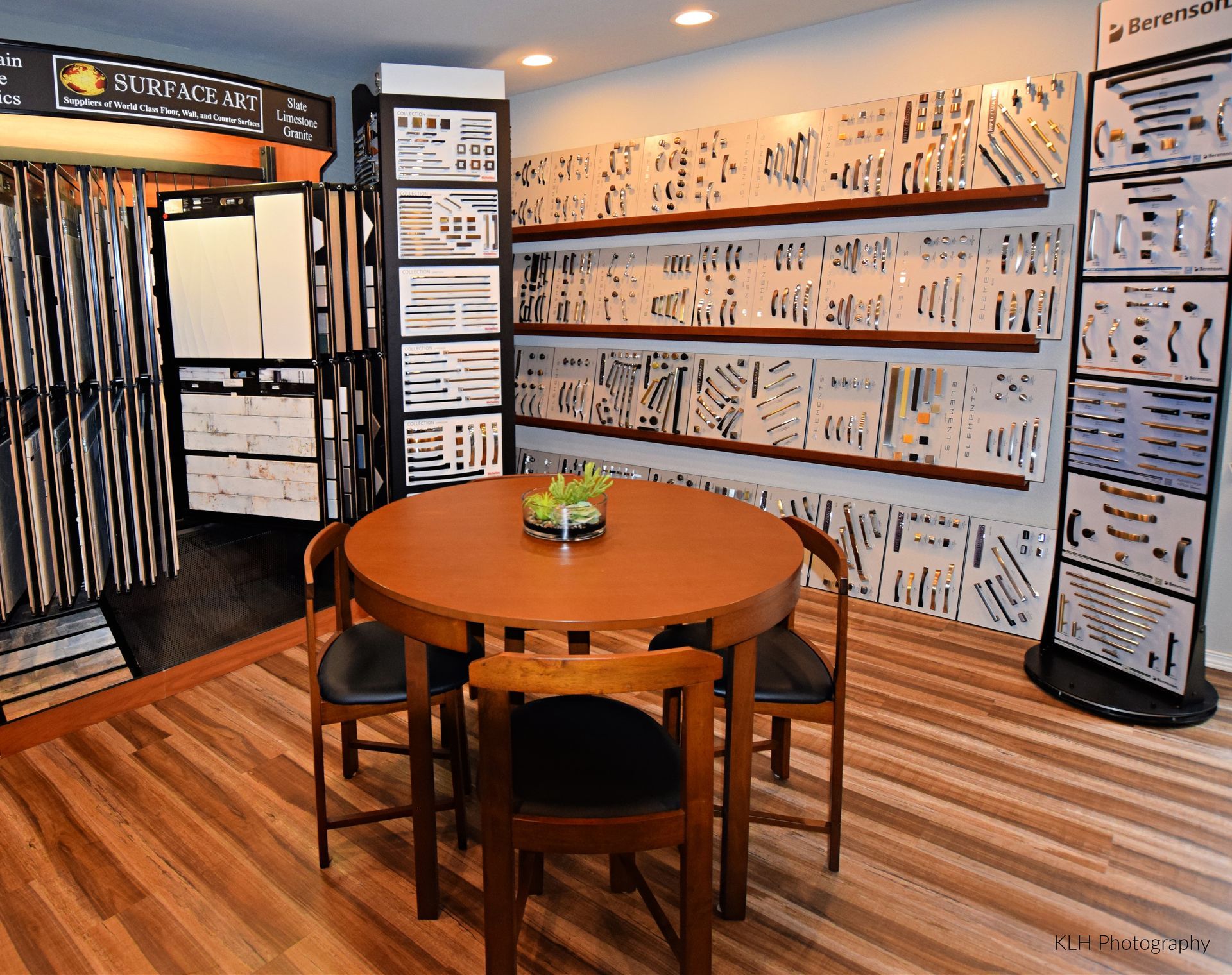 A room with a round table and chairs in it