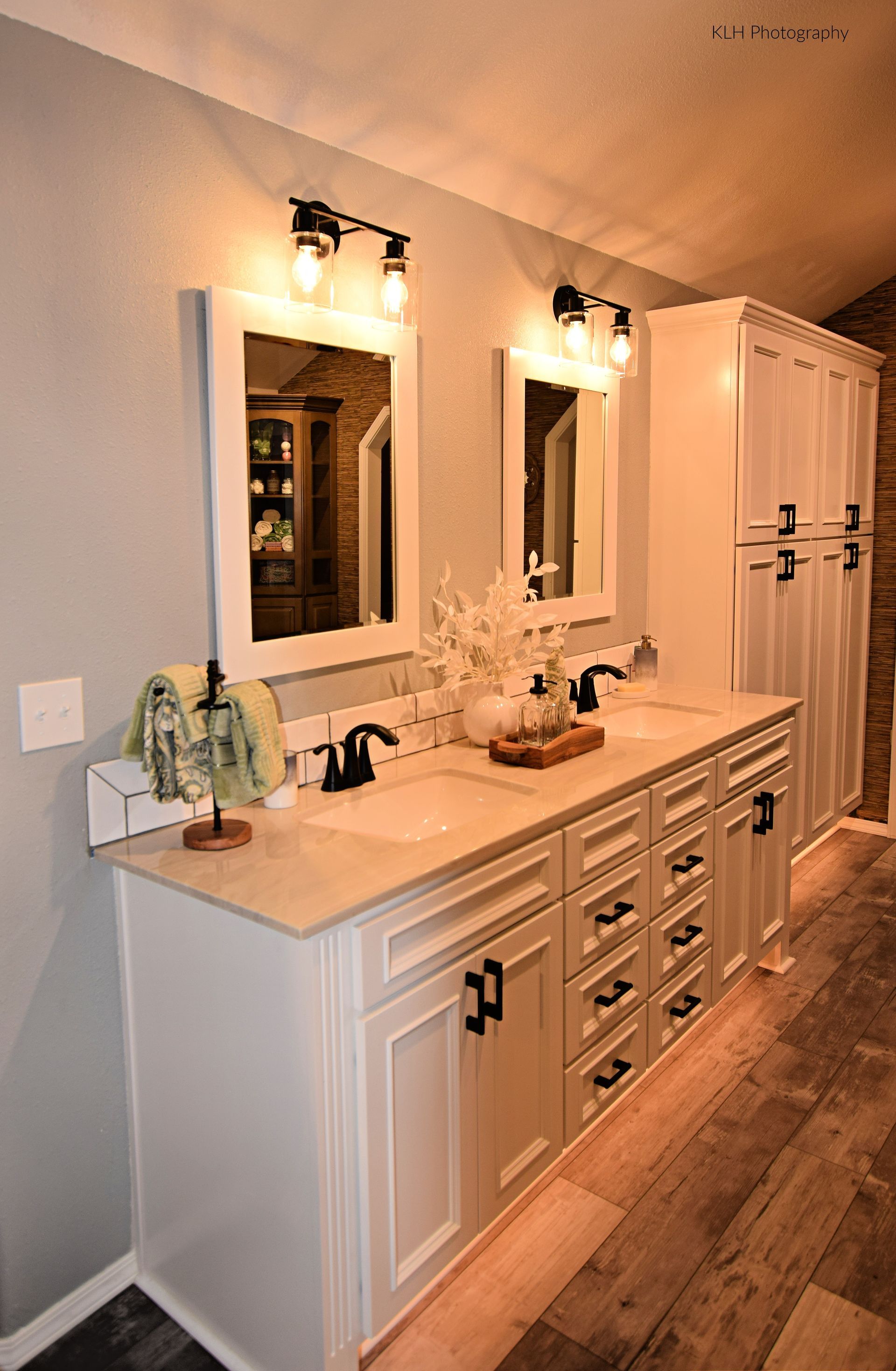 A bathroom with two sinks and two mirrors.