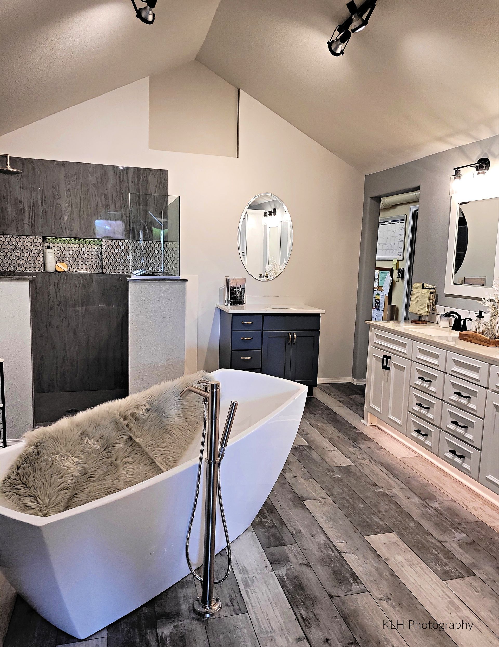 There is a bathtub in the middle of the bathroom.