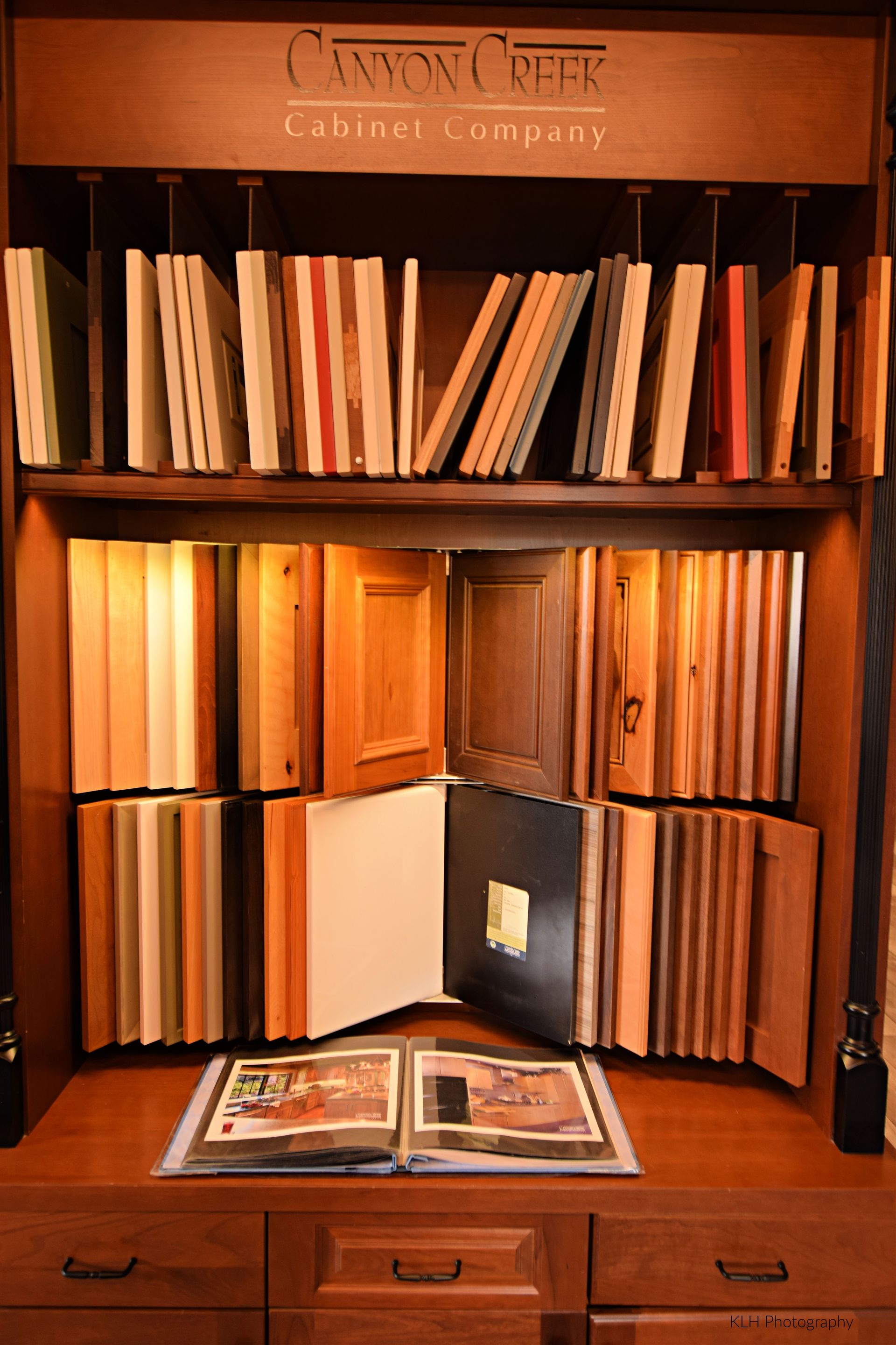 A display of cabinet doors and drawers from the cabinet company