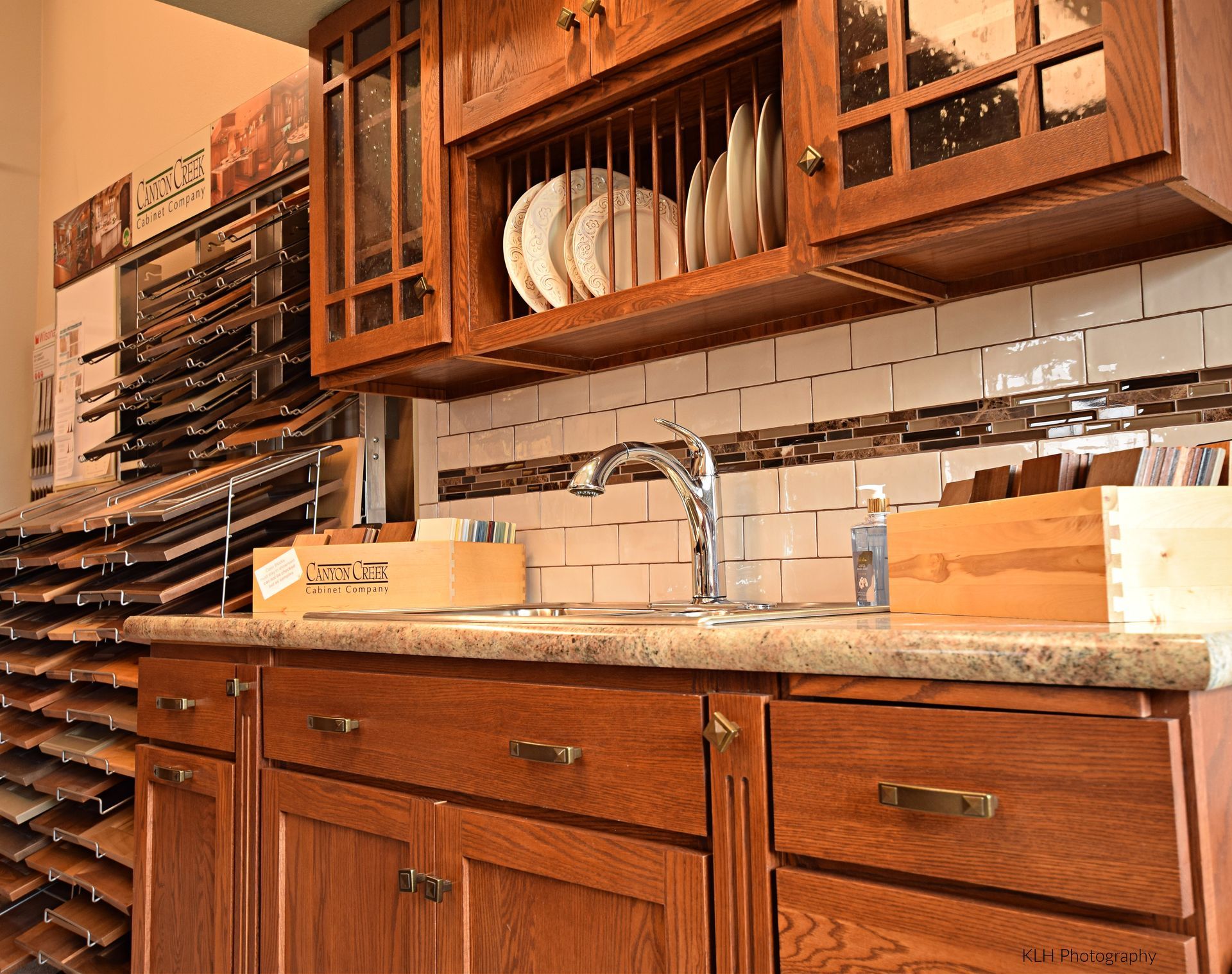 A kitchen with wooden cabinets and a sink.