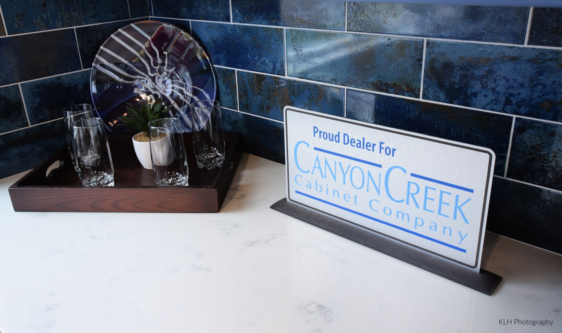 A canyon creek carpet company sign sits on a counter