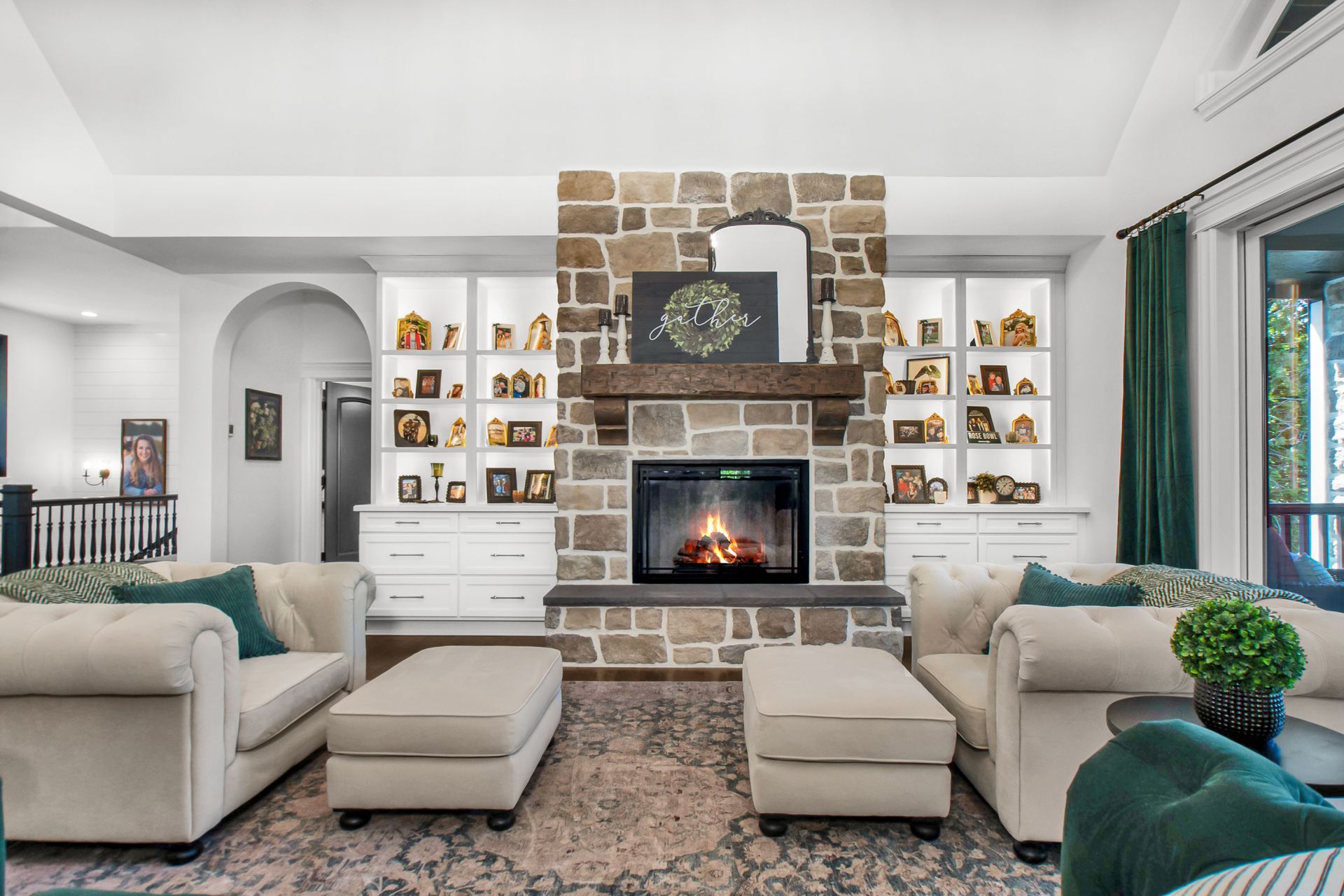 A living room filled with furniture and a fireplace.