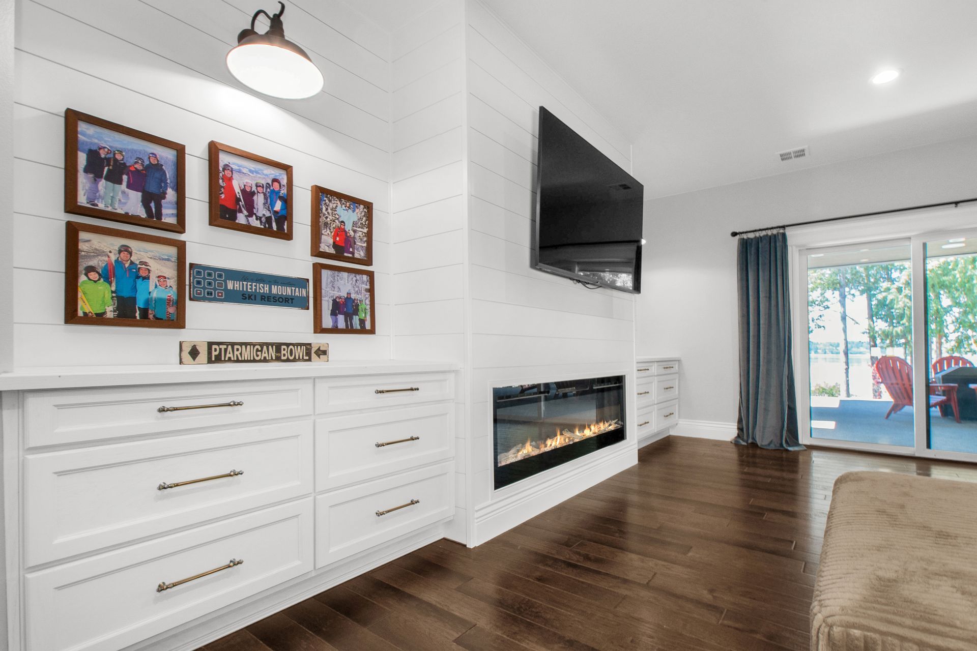 A living room with a fireplace and a flat screen tv.