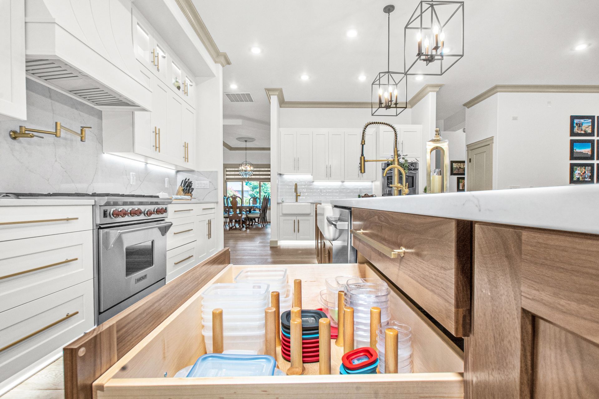 A kitchen with a wooden drawer filled with utensils.