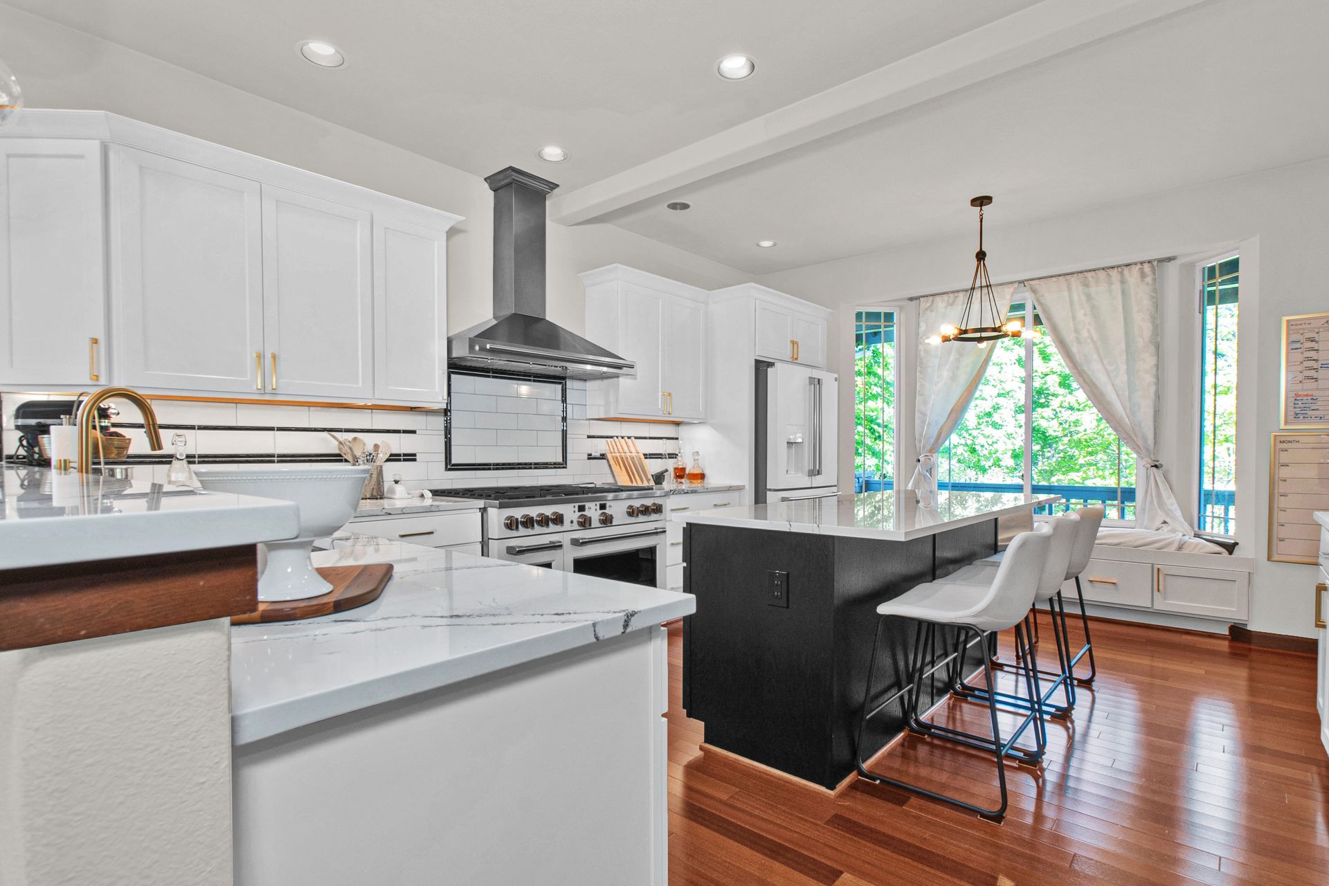A bathroom with a sink and a large mirror