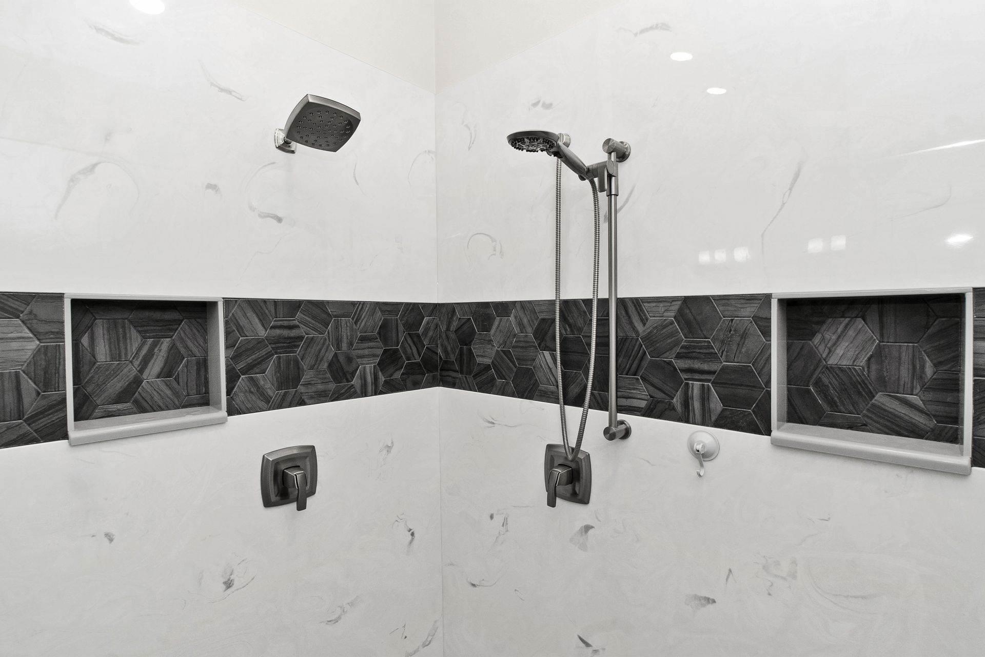 A bathroom with two sinks and two mirrors