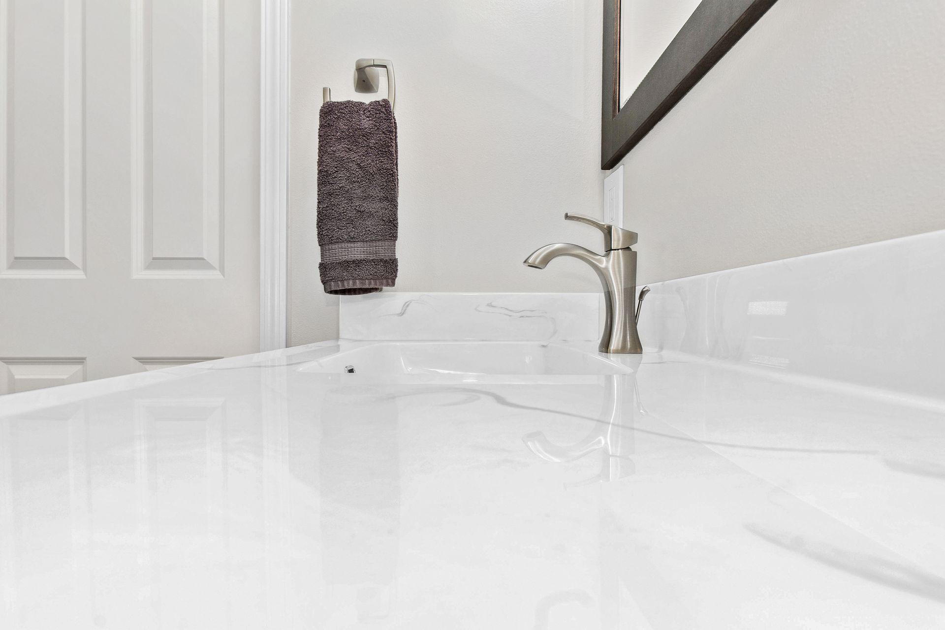 A bathroom with two sinks and a walk in shower.