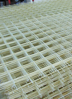 White and beige fiberglass mesh in a grid pattern.
