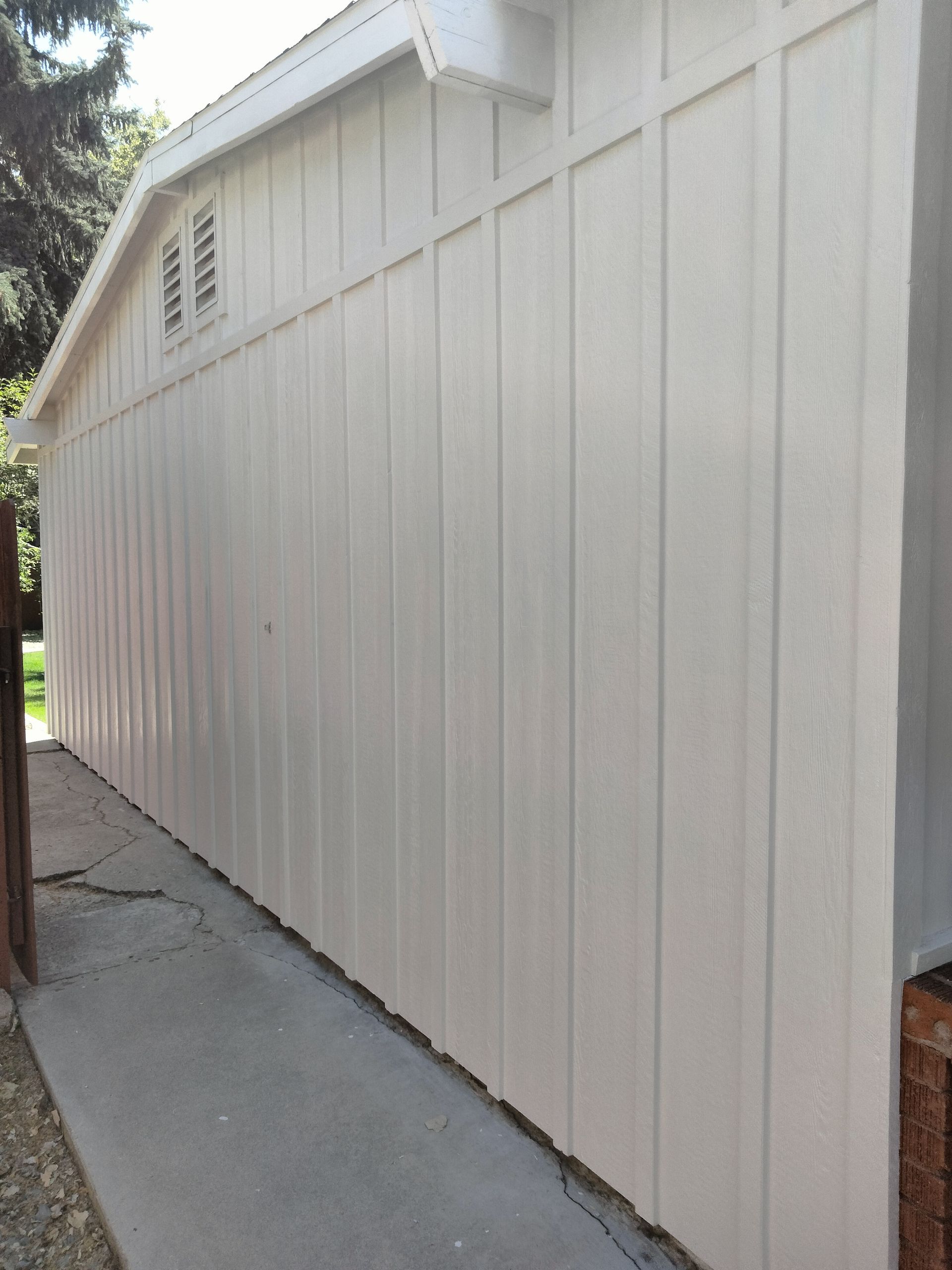 A person is using a drill to drill a hole in a piece of wood.