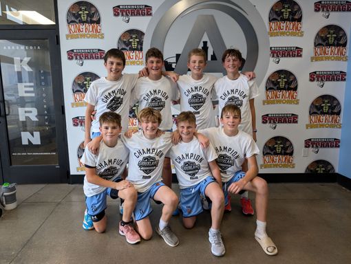 A group of young boys are posing for a picture.