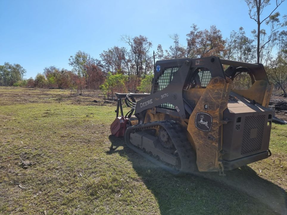 View From Behind of a Mulching Track Machine at Work in a Field — Land Clearing in Good Night, QLD