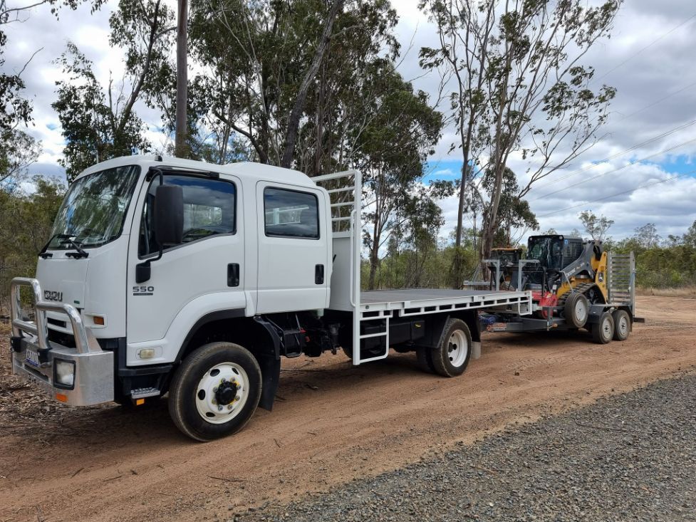 White Truck and Mulching Track at Rest in a Field — Land Clearing in Good Night, QLD