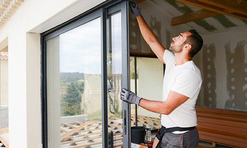 Commercial Glass — Man Installing Bay Window in Asheville, NC