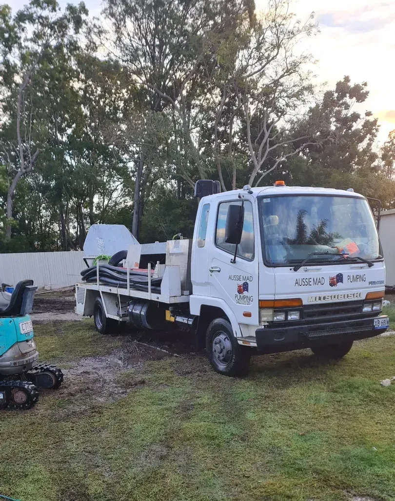 A Concrete Pump is Pouring Concrete on a Construction Site — Aussie Mad Pumping In Wondunna, QLD