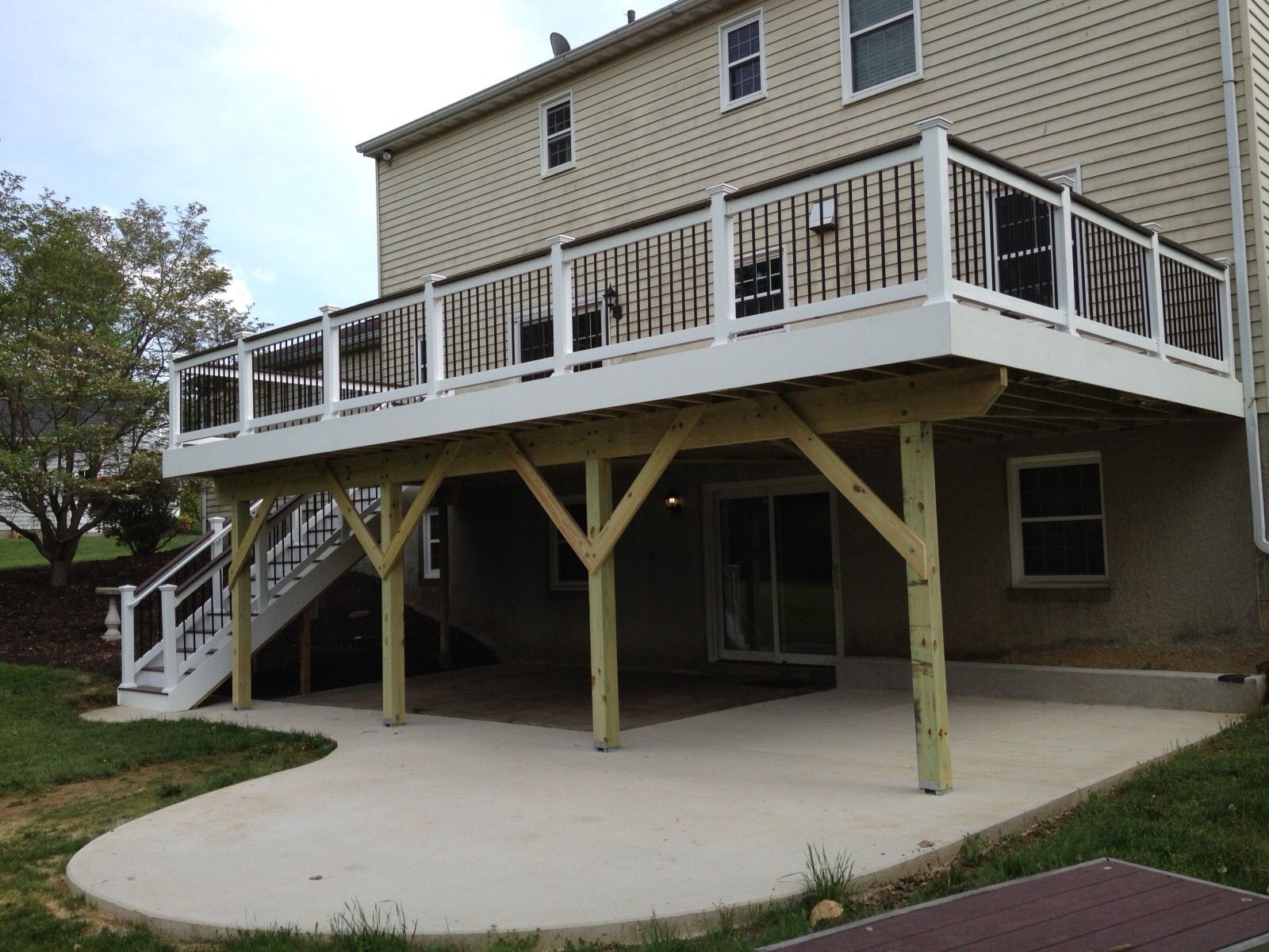 A house with a large deck and stairs