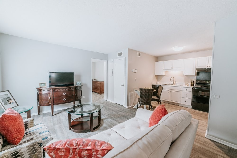 A living room filled with furniture and a flat screen tv.
