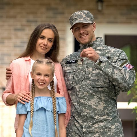 Military Man with Family — Columbus, GA — Sanera Van Service Inc.