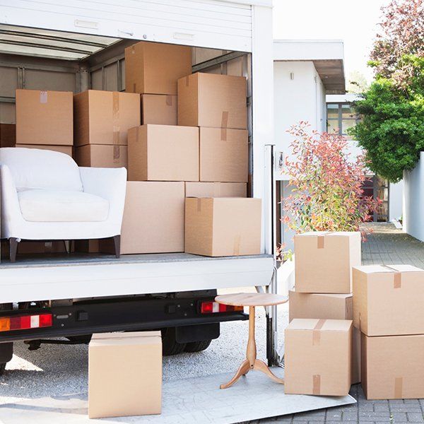 Boxes on Ground Near Moving Van — Columbus, GA — Sanera Van Service Inc.