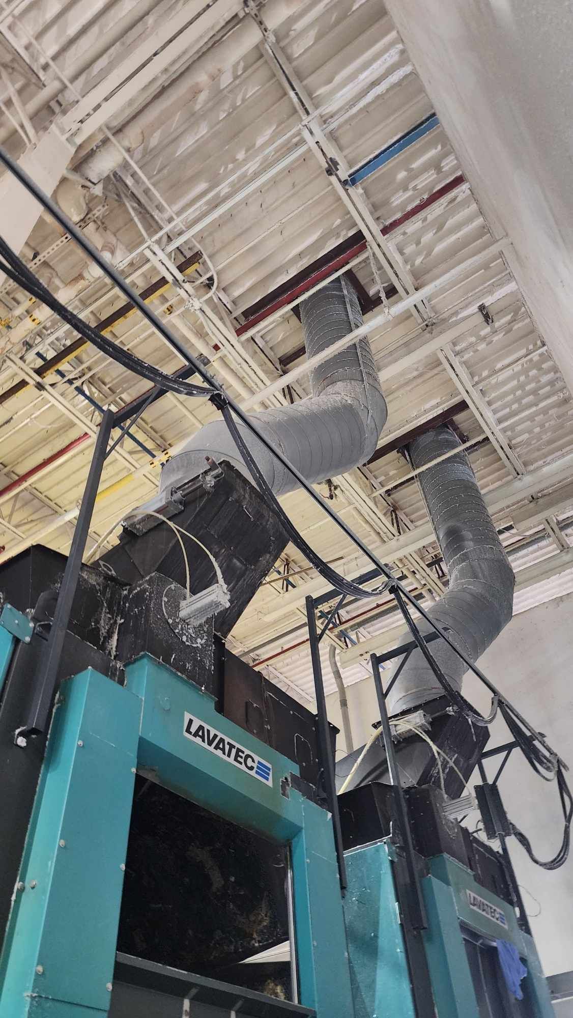 A close up of a dirty air duct with a hole in the middle.