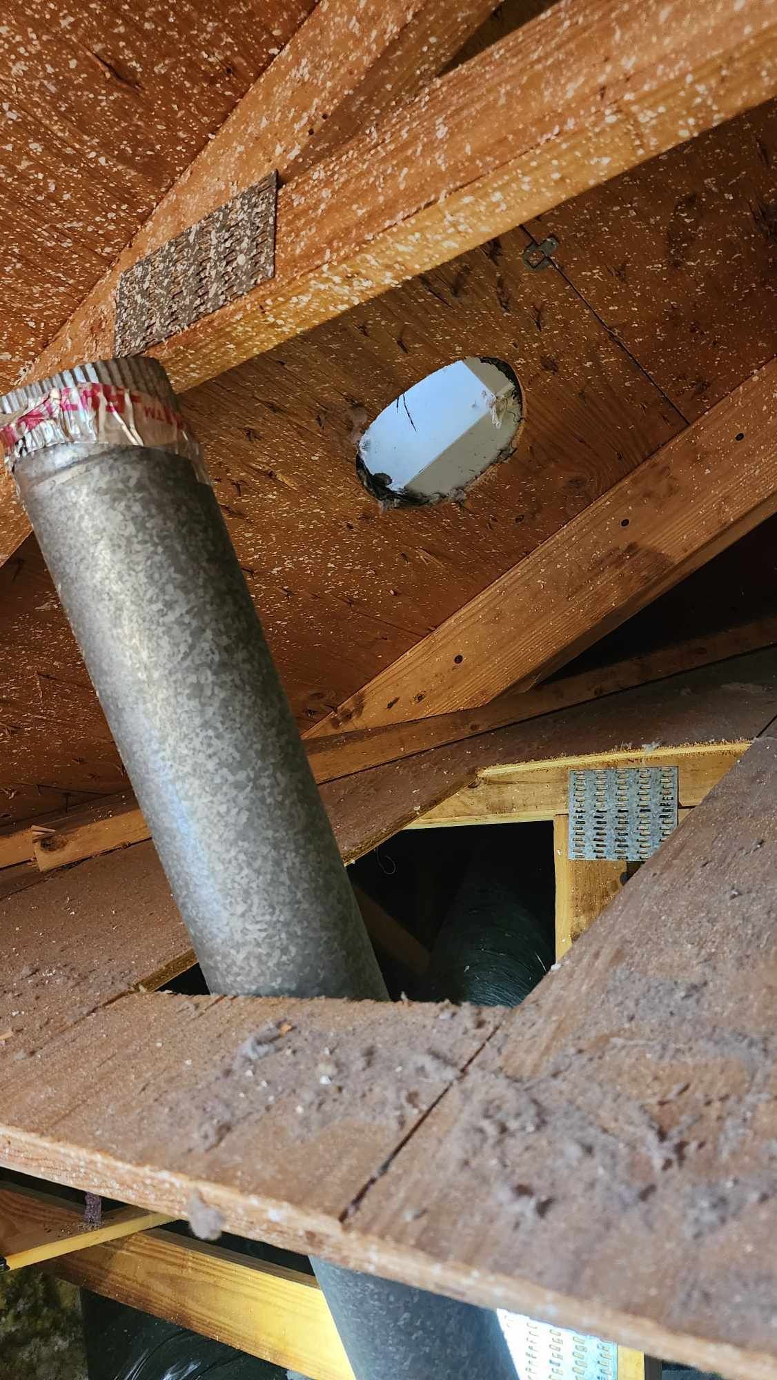 A close up of a duct with a hole in it.