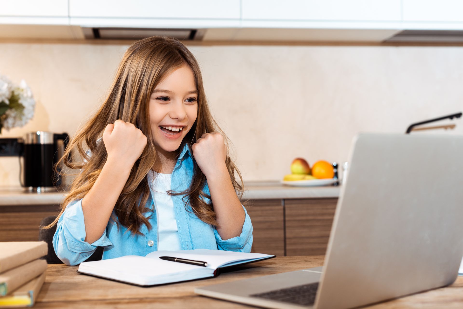 Focused young girl diligently working on her homework at her desk, embodying the discipline and conc