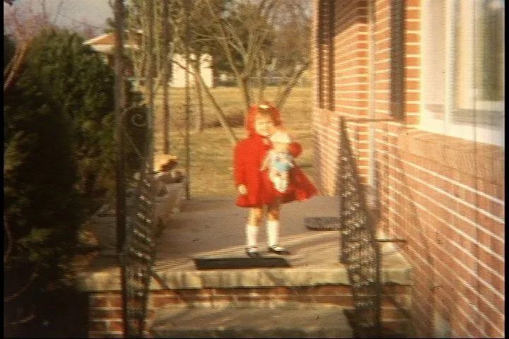 Kid Holding A Doll