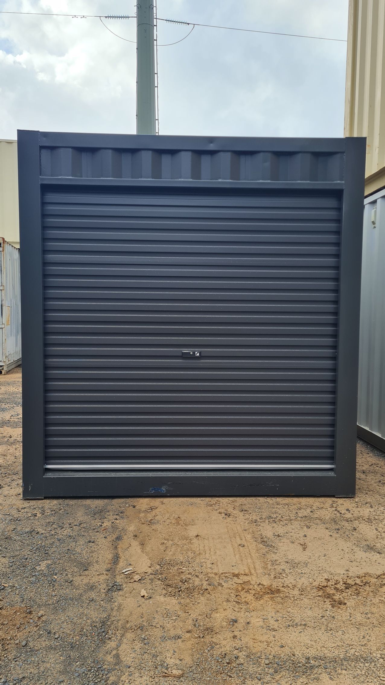 A Dark Gray Storage Container — East Coast Containers Shipping Containers and Transport in Chevallum, QLD