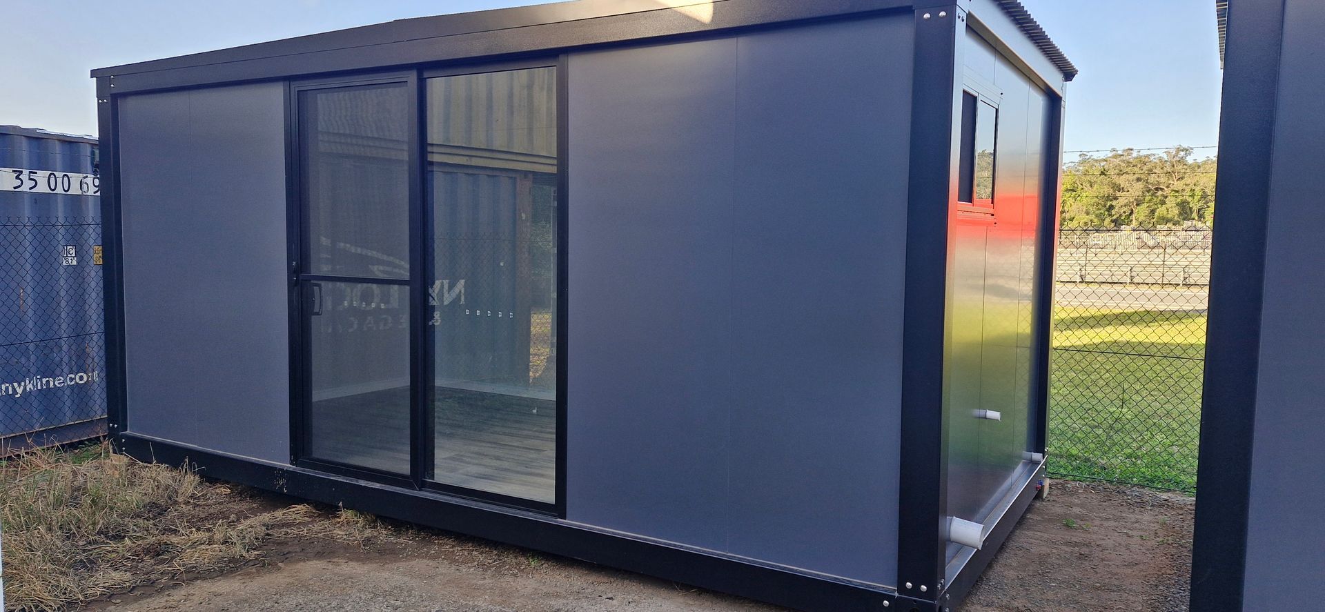 A Gray Container Building — East Coast Containers Shipping Containers and Transport in Chevallum, QLD