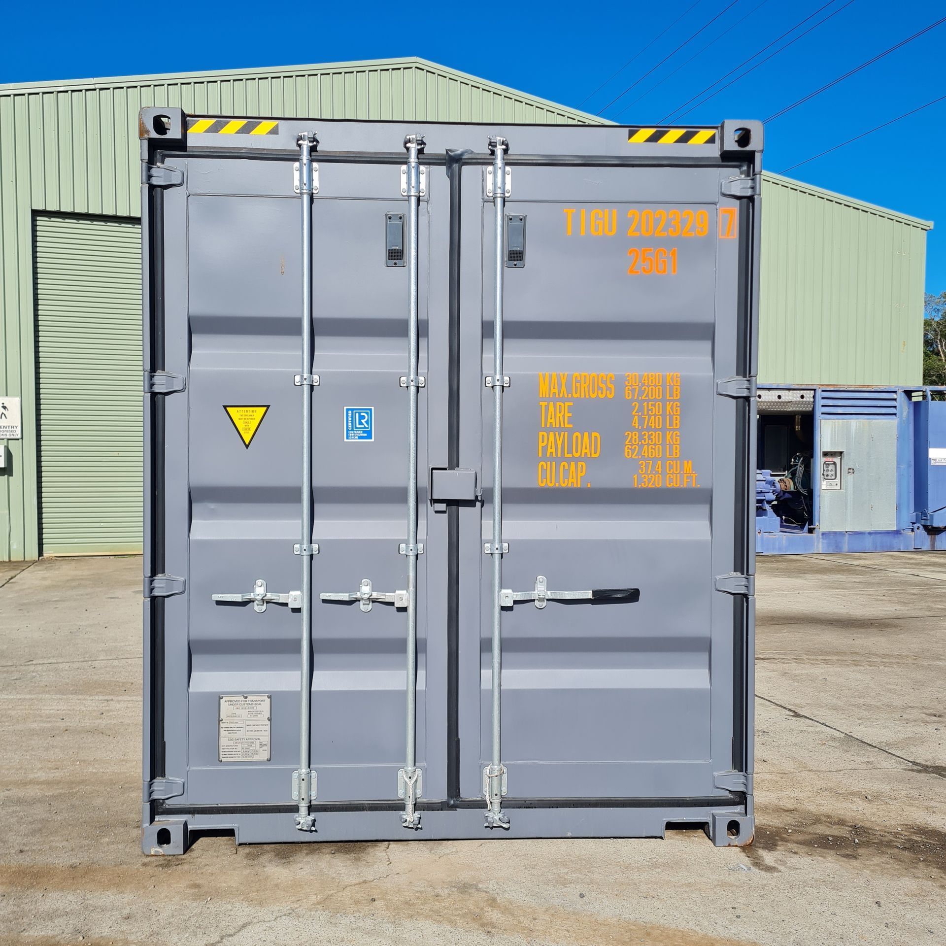 Gray Shipping Container on Concrete — East Coast Containers Shipping Containers and Transport in Chevallum, QLD