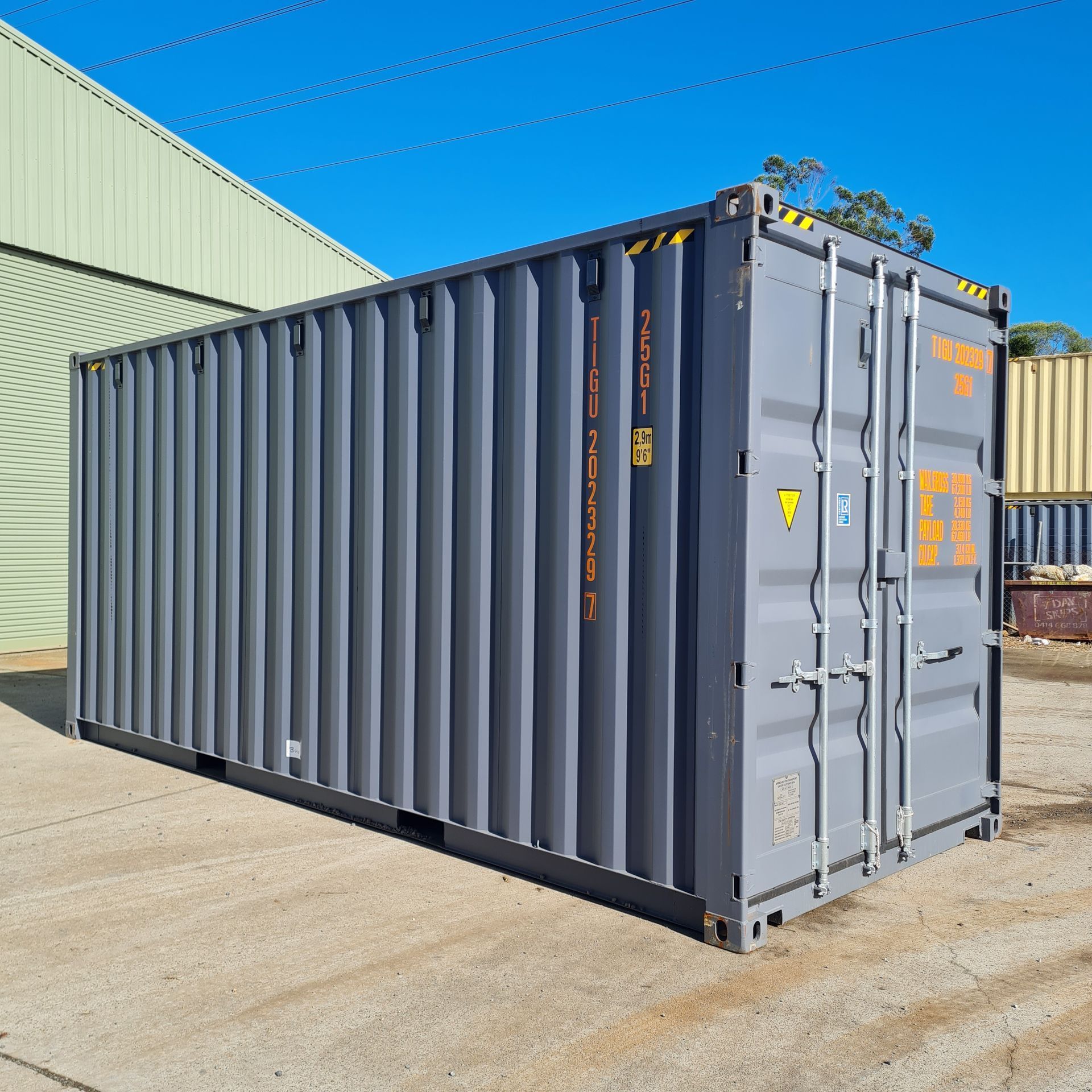 Gray Shipping Container on Concrete — East Coast Containers Shipping Containers and Transport in Chevallum, QLD