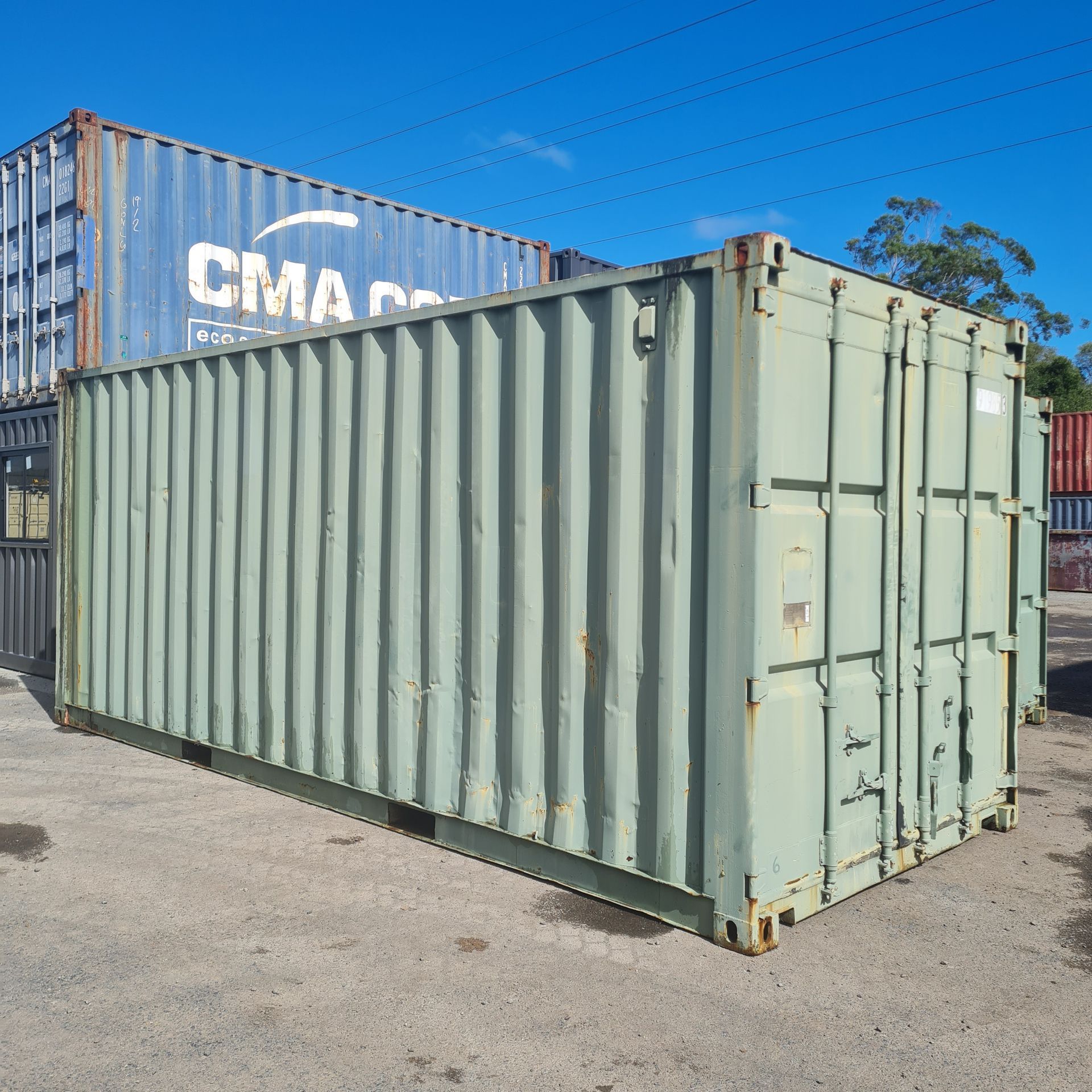 Green Shipping Container With Closed Doors — East Coast Containers Shipping Containers and Transport in Chevallum, QLD