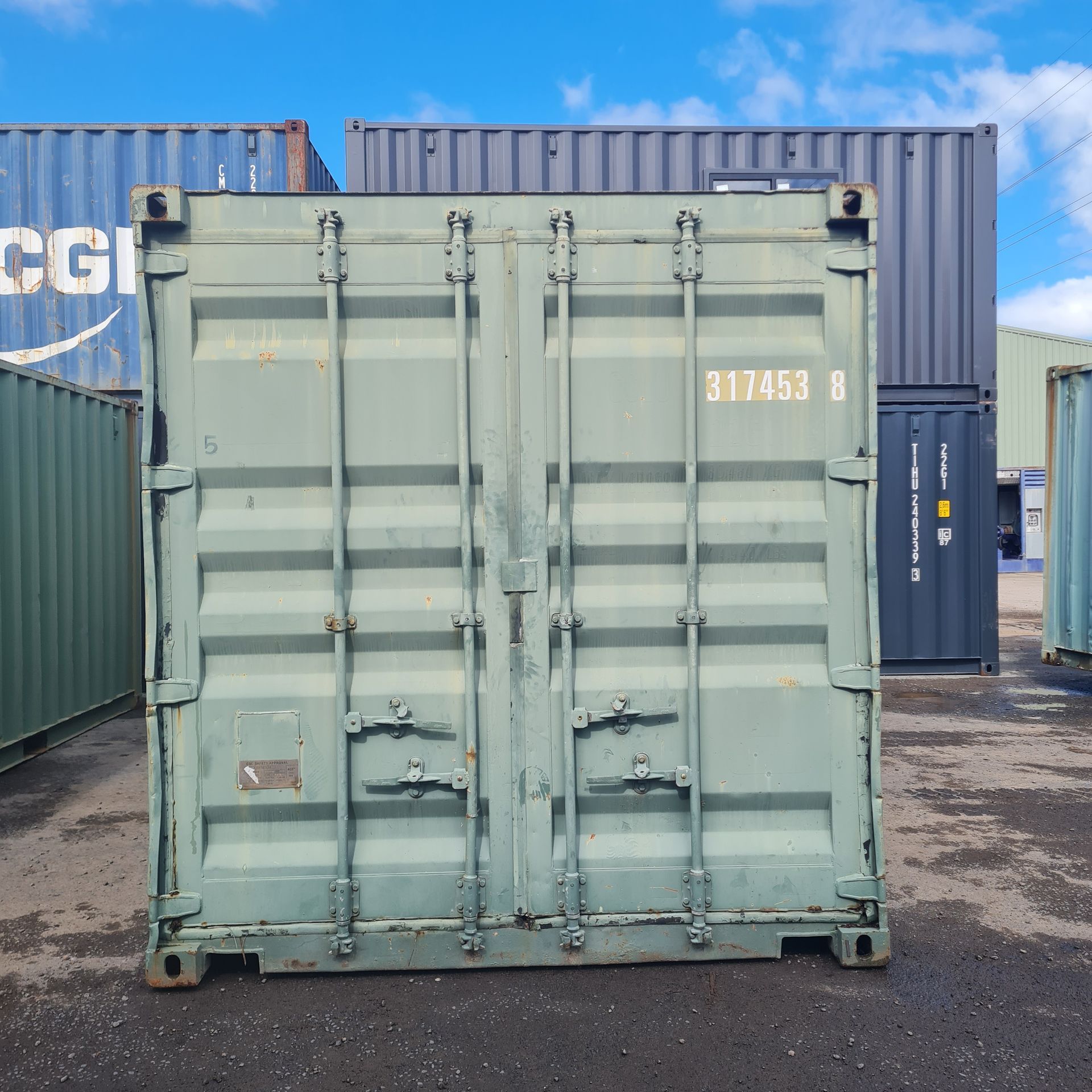 Green Shipping Container With Closed Doors — East Coast Containers Shipping Containers and Transport in Chevallum, QLD
