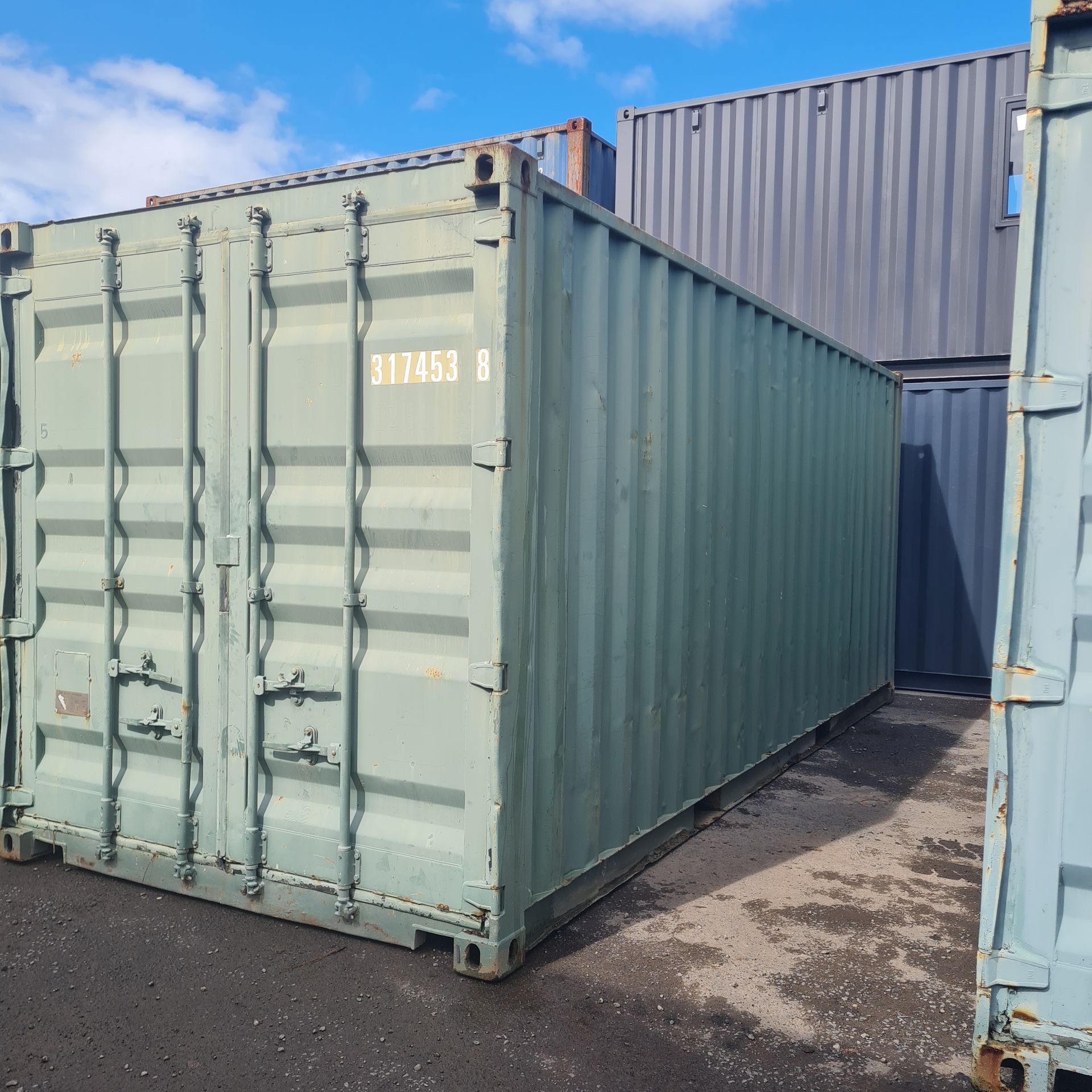 Green Shipping Container With Closed Doors — East Coast Containers Shipping Containers and Transport in Chevallum, QLD