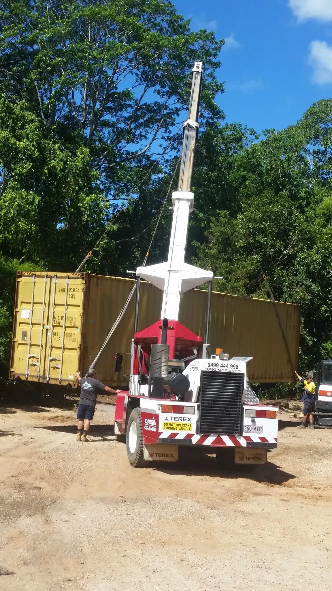 Crane Lifting a Yellow Shipping Container — East Coast Containers Shipping Containers and Transport in Chevallum, QLD