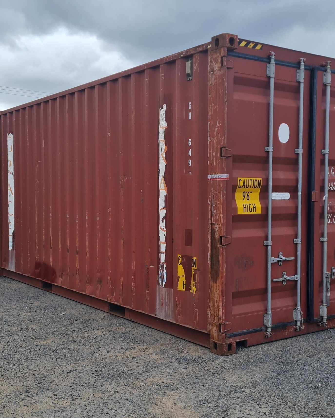 Red Shipping Container on Gravel — East Coast Containers Shipping Containers and Transport in Sunshine Coast, QLD