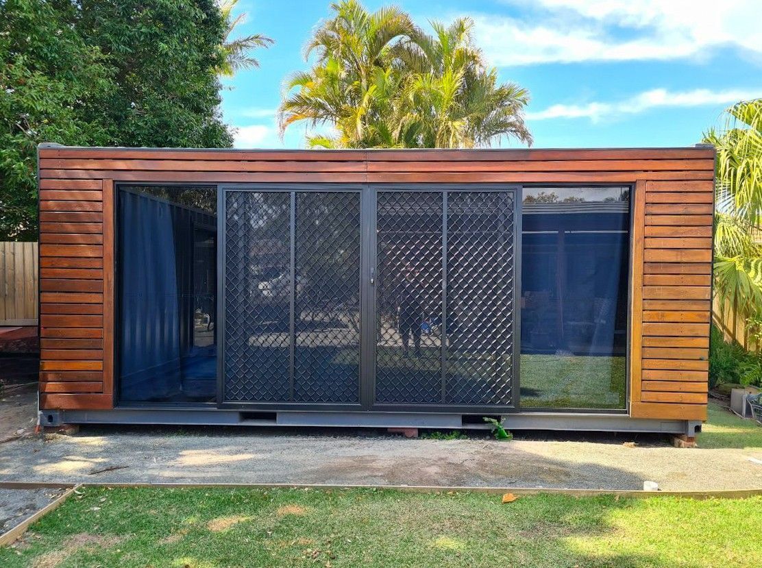 Wooden Modern Cabin With Large Glass Front — East Coast Containers Shipping Containers and Transport in Chevallum, QLD
