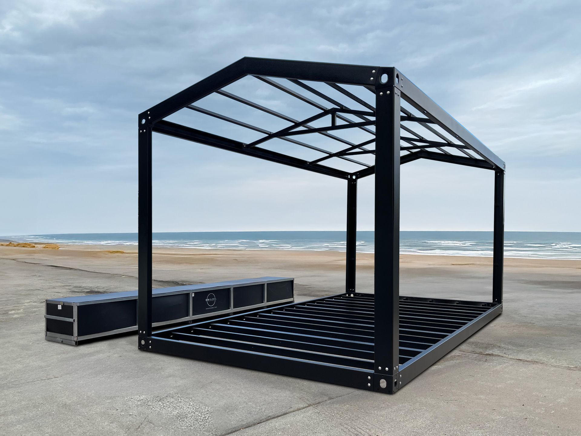 Black Metal Gazebo Frame on a Beach — East Coast Containers Shipping Containers and Transport in Chevallum, QLD