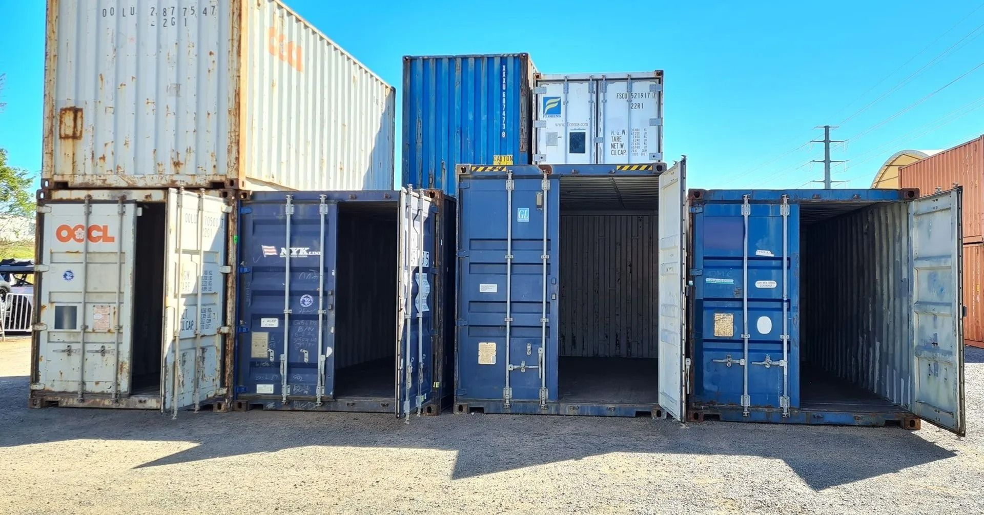 A Row of Open, Colorful Shipping Containers — East Coast Containers Shipping Containers and Transport in Chevallum, QLD