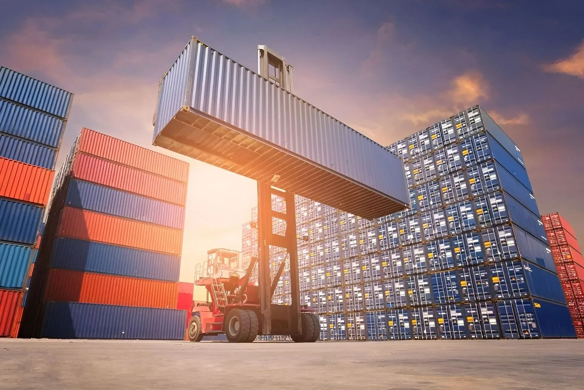 A Reach Stacker Lifts a Shipping Container — East Coast Containers Shipping Containers and Transport in Chevallum, QLD A Reach Stacker Lifts a Shipping Container — East Coast Containers Shipping Containers and Transport in Chevallum, QLD