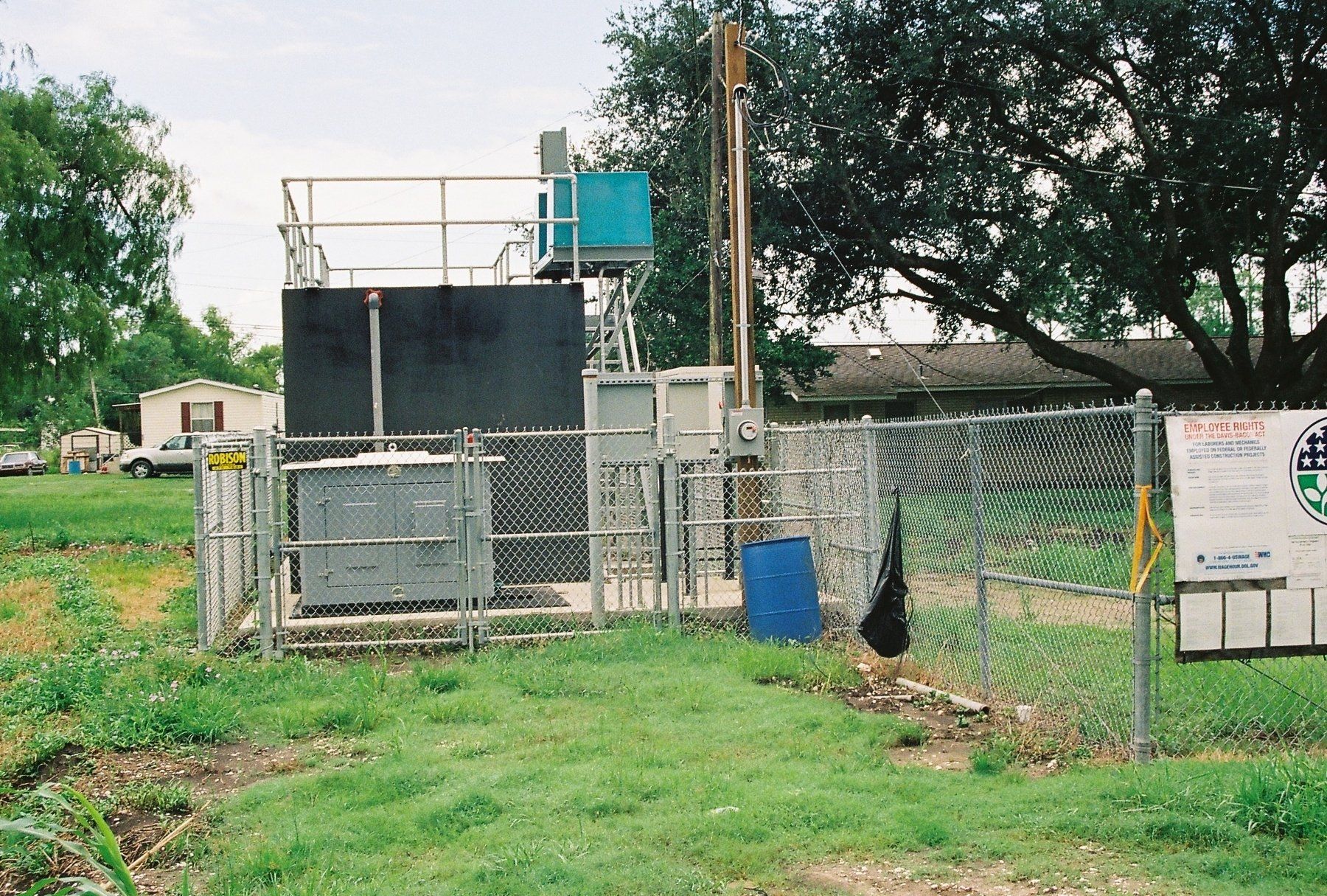 A fenced in area with a sign that says ' texas ' on it