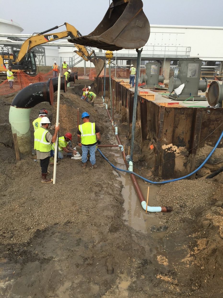 A group of construction workers are working on a construction site.