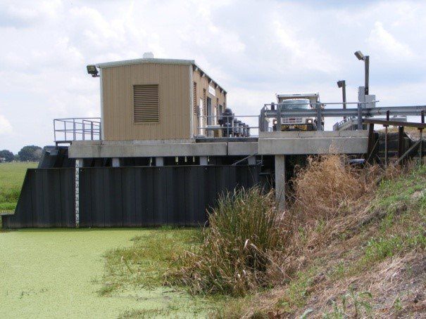 A boat is floating on top of a body of water
