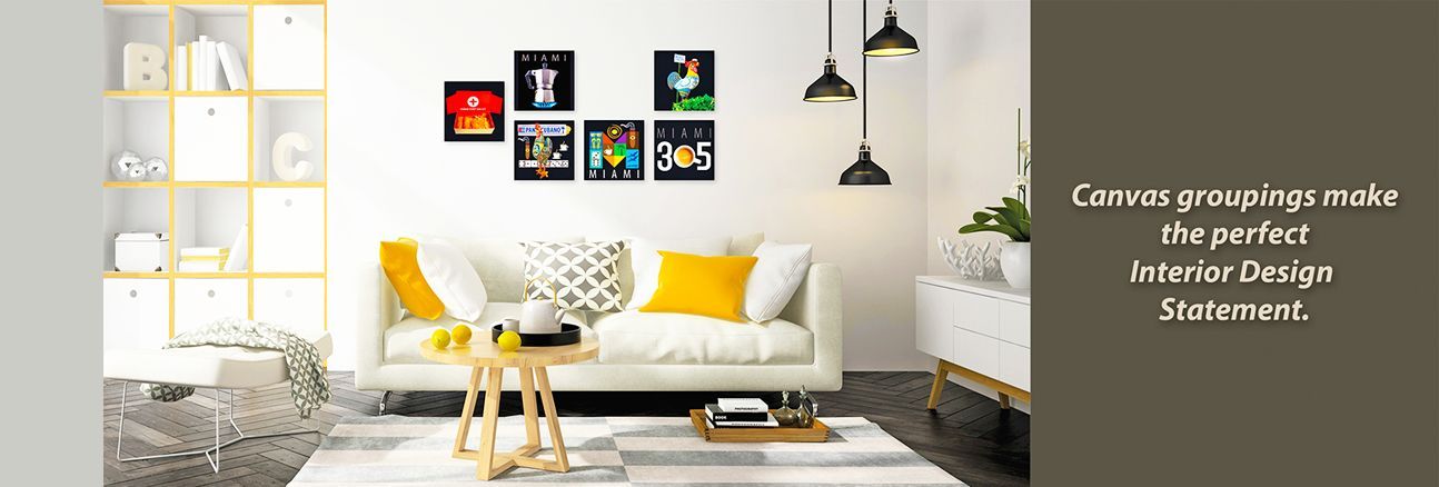 Living room with wall art above a white couch, gold accents and rug.