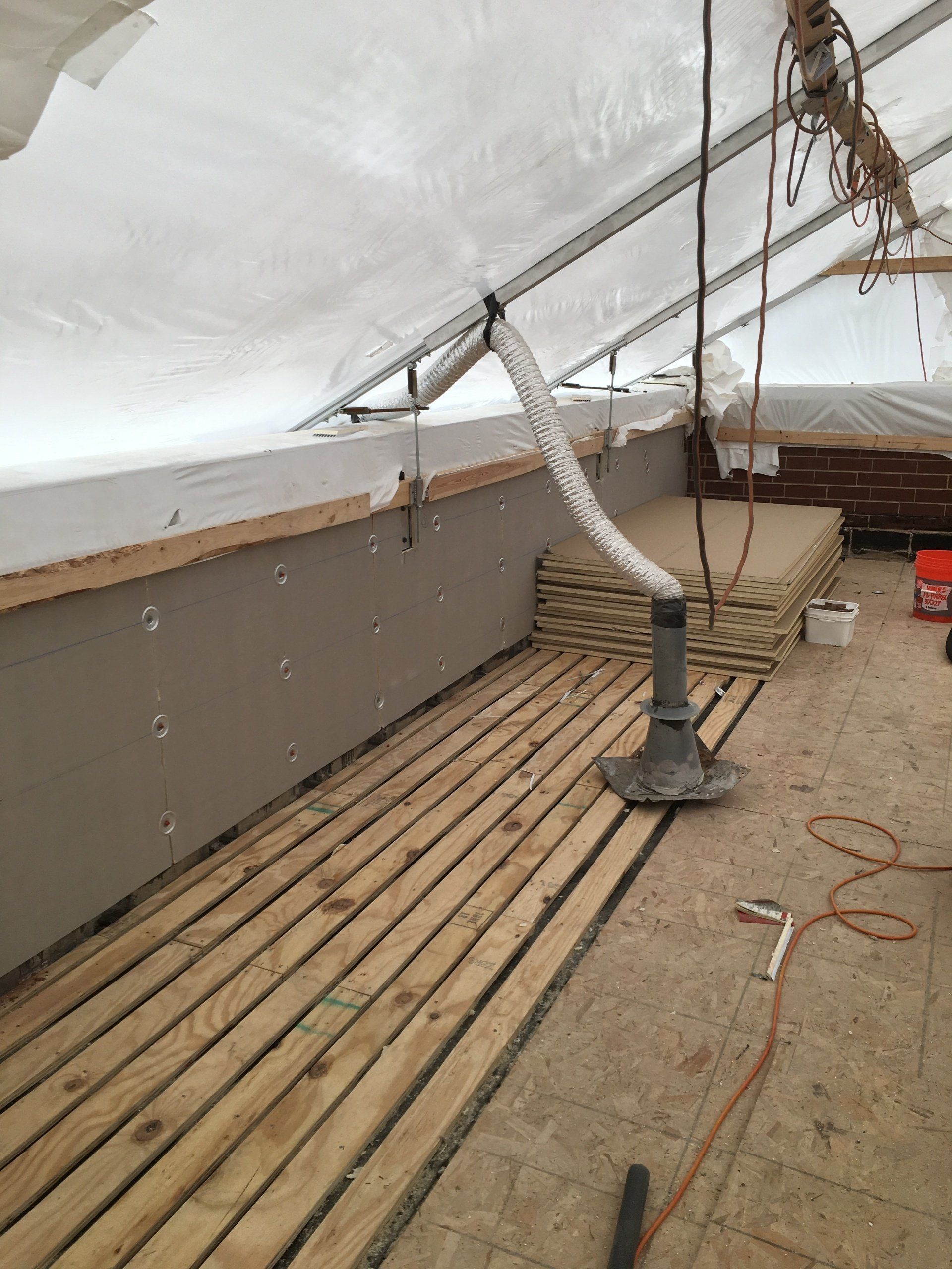 WickRight roof vent installed on parapet wall under 365 Construction Tent in Chicago
