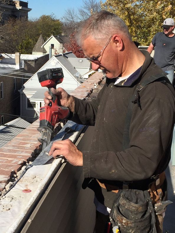 WickRight Parapet Vent inventor Bob Kelly preps parapet wall for parapet vent installation.