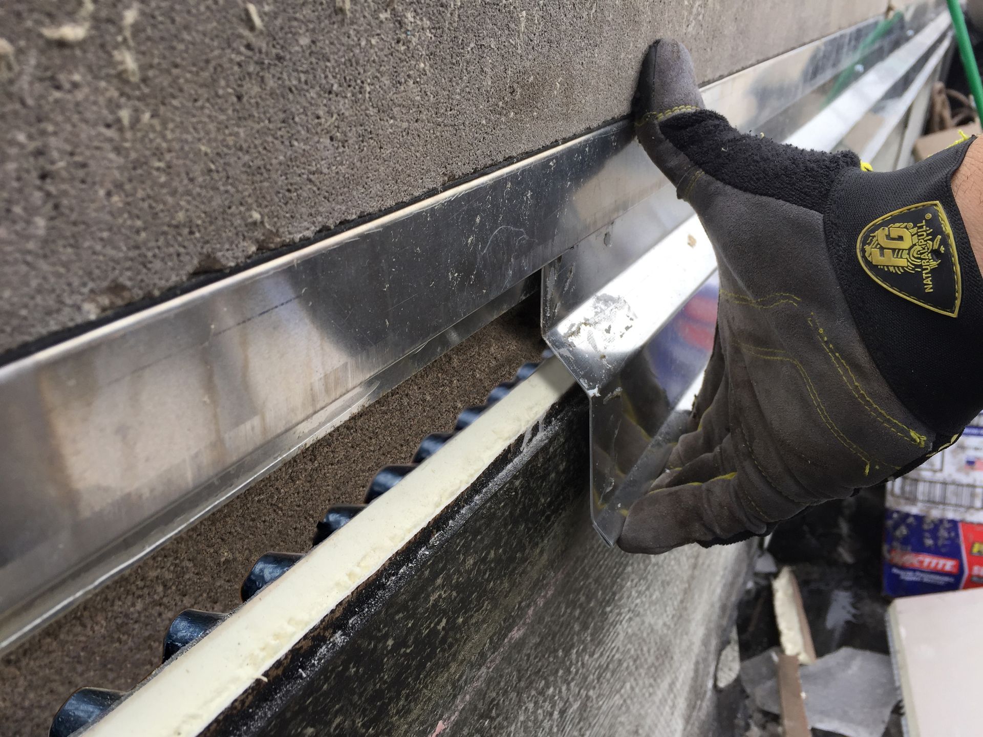 WickRight Offset Counter Flashing being installed into WickRight Vented Receiver Clip over WickRight Roof Vent