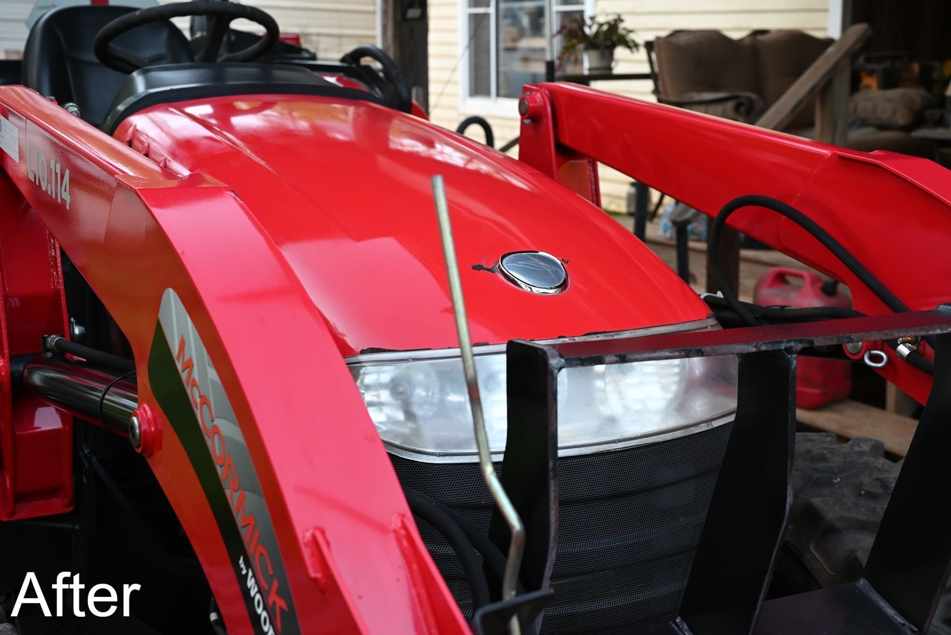 Red tractor hood with silver accents and front-end loader; 