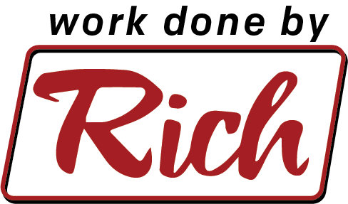 A red and white sign that says `` work done by rich ''