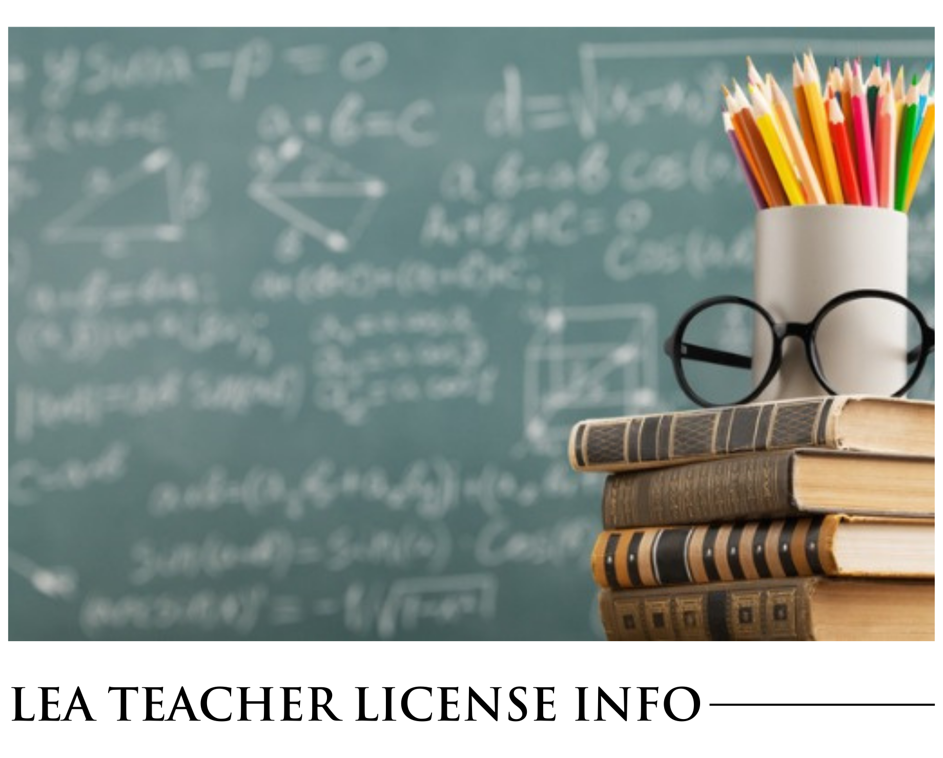 A stack of books with glasses and pencils in front of a blackboard